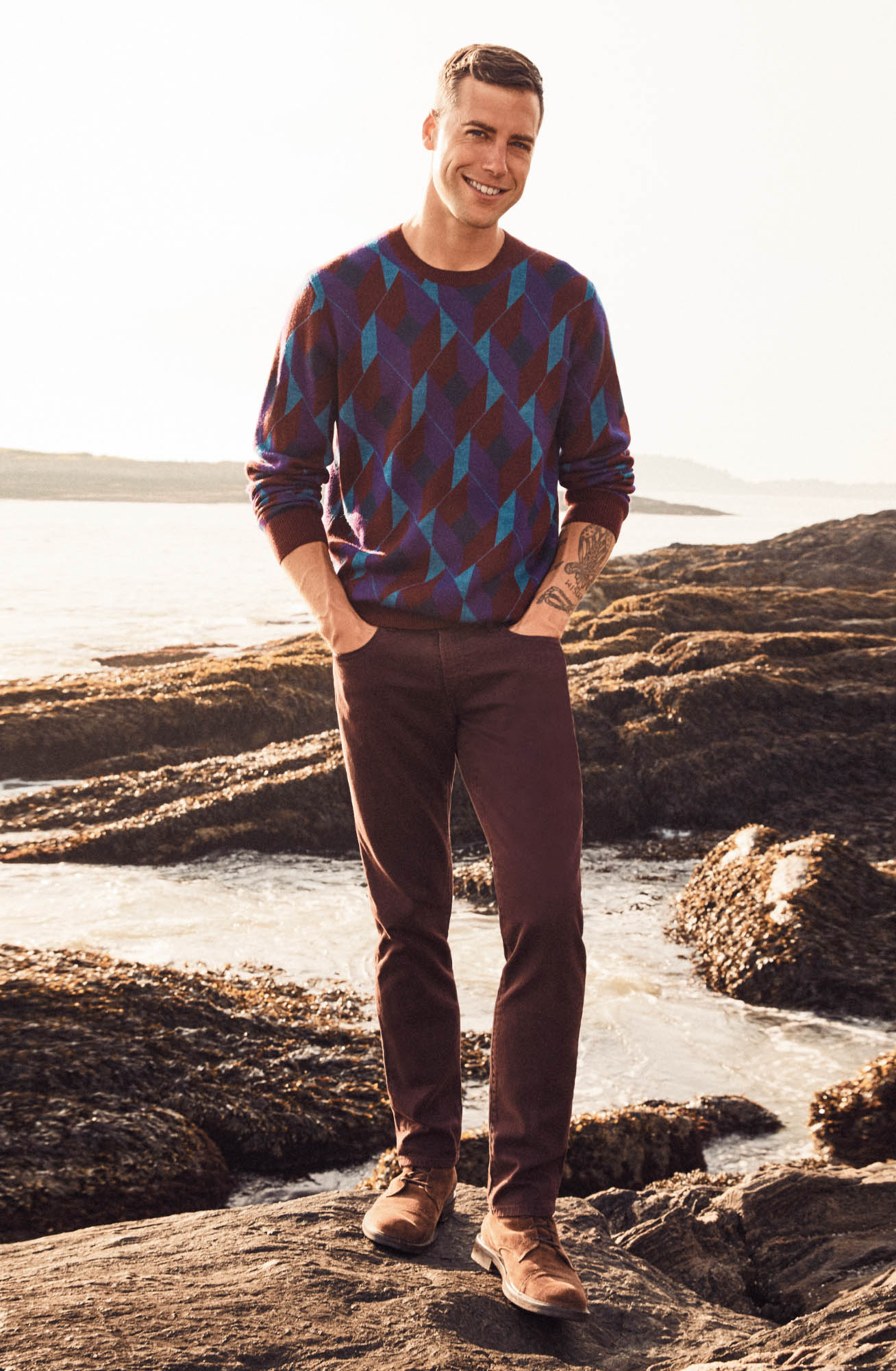 Brandon Sewall smiling by the water