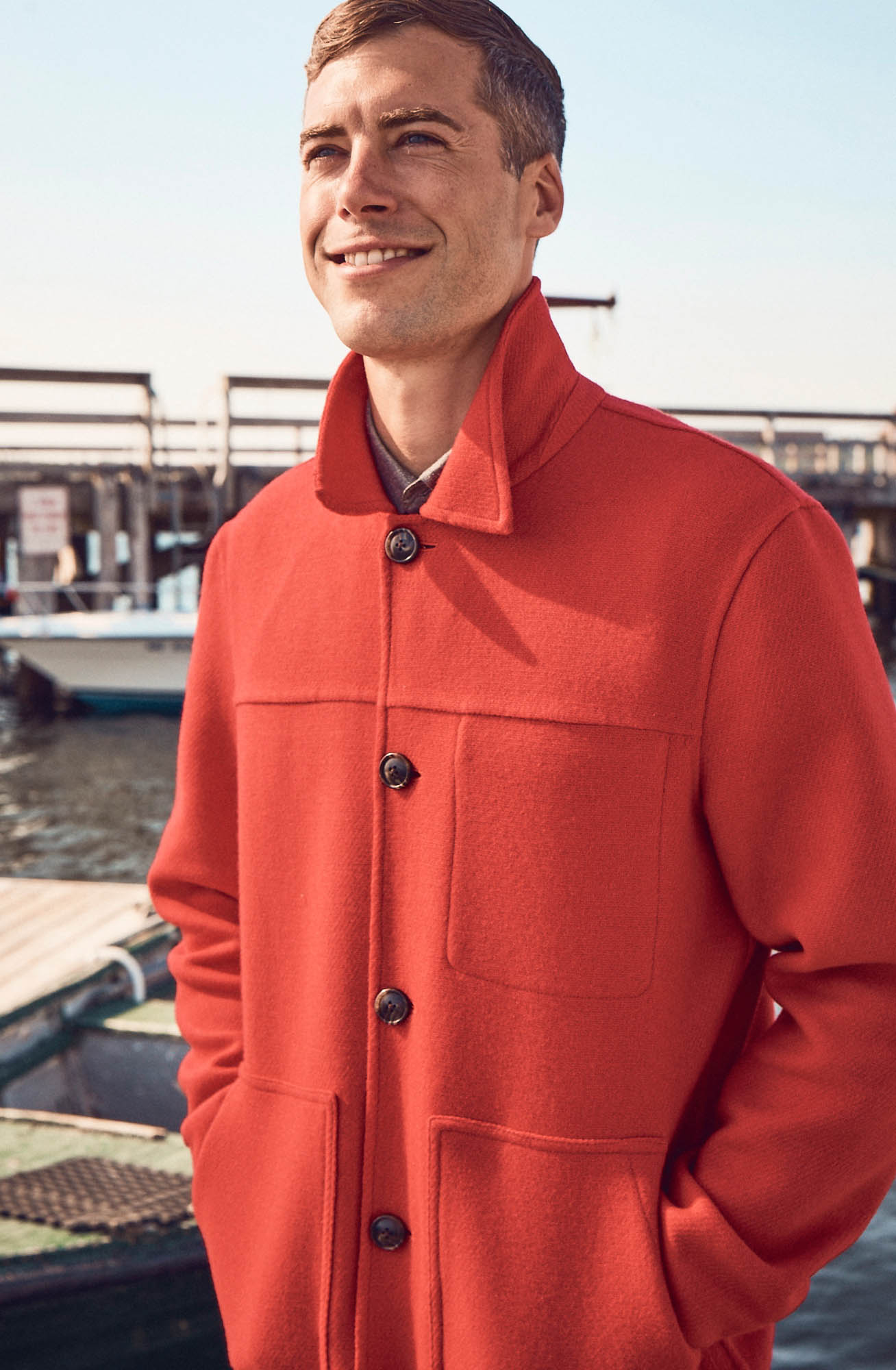 Brandon Sewall smiling in a red coat