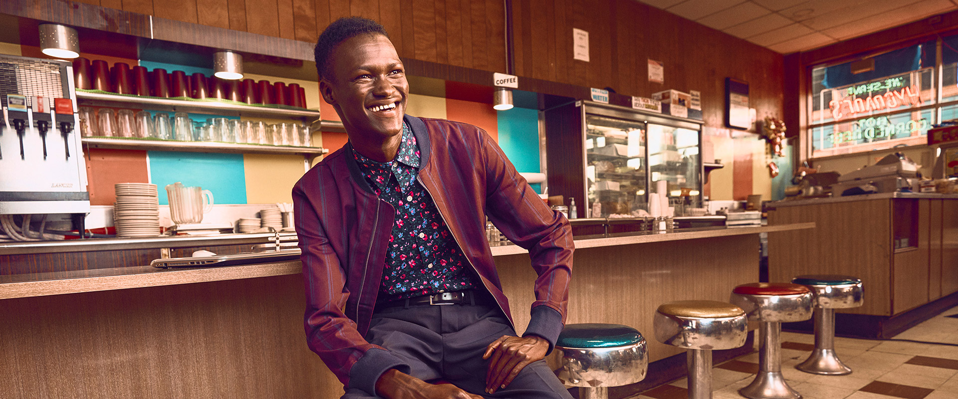 Lual sitting in a diner
